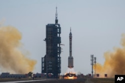 China has launched the youngest-ever crew to space in its efforts to send astronauts to the moon.