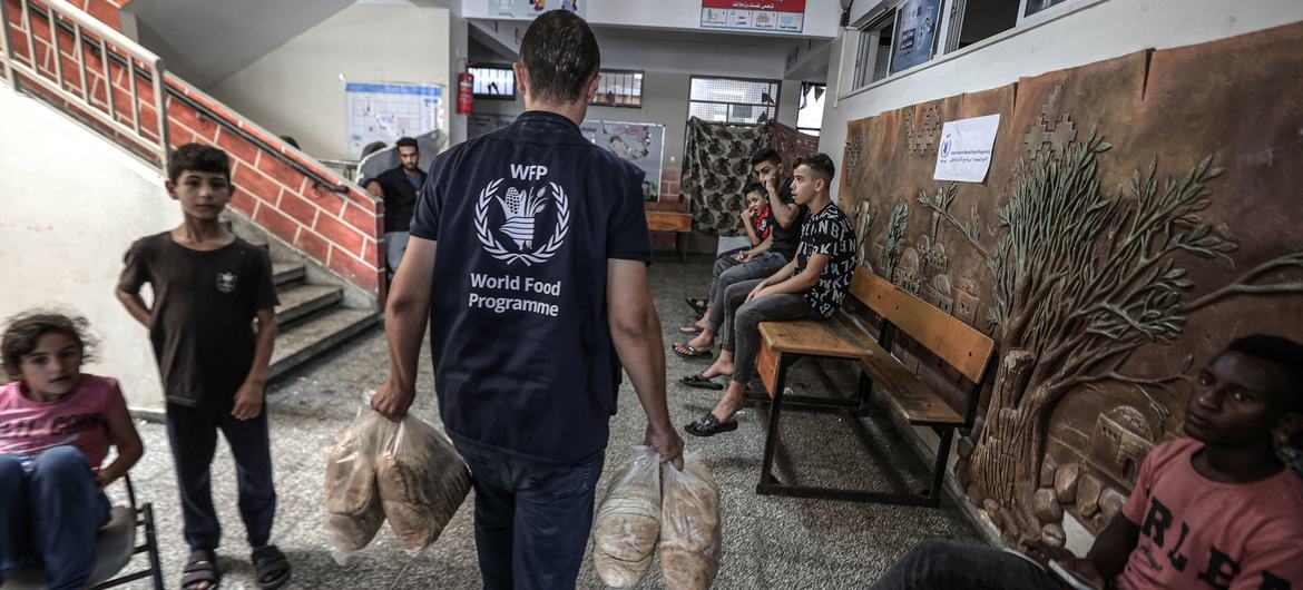 Bread is distributed at an UNRWA school in Gaza.