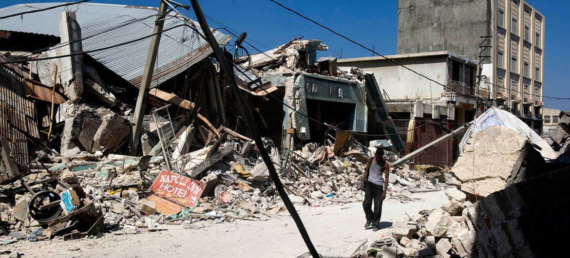 A man walks through the rubble of collapsed buildings in downtown Port au Prince, Haiti, following the earthquake in January 2010.