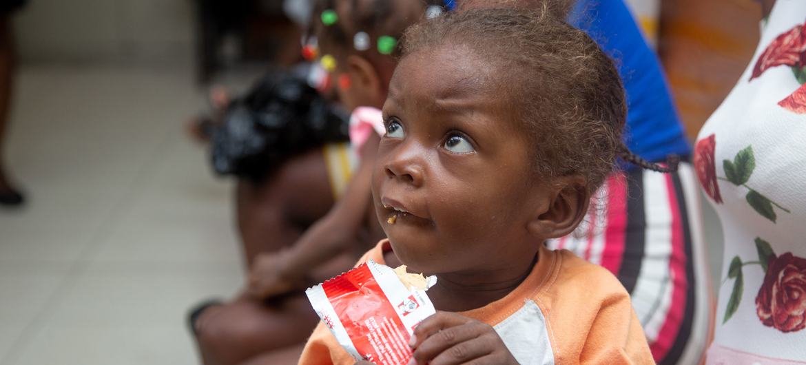 A child eats ready-to-use therapeutic food at a health and nutrition centre in Port-au-Prince, Haiti.