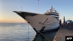 FILE - This handout photo courtesy of the U.S. Department of Justice released on May 5, 2022, shows the Amadea yacht owned by sanctioned Russian oligarch Suleiman Kerimov docked in Lautoka, Fiji.