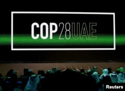 FILE - 'Cop28 UAE' logo is displayed on a screen at a climate conference in Abu Dhabi on Jan. 16, 2023. The U.N. Climate Change Conference, known as COP28, is scheduled for the end of November.