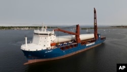 FILE - The ship UHL Felicity, carrying parts for offshore wind turbines, arrives to dock, May 24, 2023, in New Bedford, Mass.