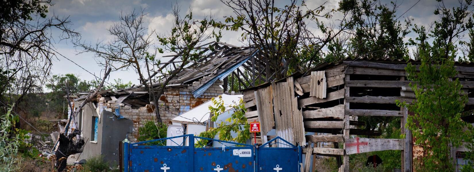 Reworded: Rebuilding of a Ukrainian village destroyed during conflict.