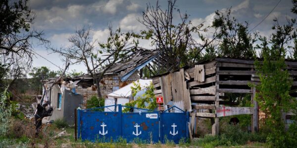 Reworded: Rebuilding of a Ukrainian village destroyed during conflict.