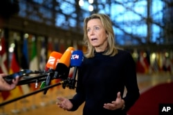 Netherland's Defense Minister Kajsa Ollongren speaks with the media as she arrives at the European Council building in Brussels, Nov. 14, 2023.