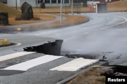 A road split by earthquakes is among the damages in the village of Grindavik, Iceland, on Nov. 14, 2023.