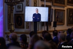 A pre-recorded message by co-founder of Microsoft and co-chair of the Bill & Melinda Gates Foundation Bill Gates is broadcast during the opening session of the Global Food Security Summit at Lancaster House in London, Nov. 20, 2023.