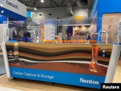 FILE - View of a model of carbon capture and storage designed by Santos Ltd. at the Australian Petroleum Production and Exploration Association conference in Brisbane, Australia, on May 18, 2022.