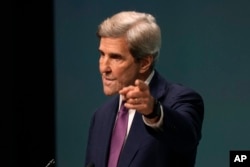 U.S. Special Envoy John Kerry speaks at a news conference at the COP28 summit on Dec. 6, 2023, in Dubai, United Arab Emirates. He said, "We’ve accomplished real things" in the first week of the climate conference.