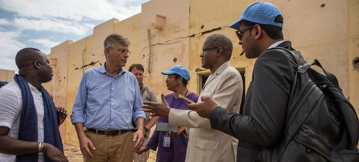 Jean-Pierre Lacroix (2nd from left), the UN peacekeeping chief visits, in 2018, a military facility attacked by terrorists in northern Mali.