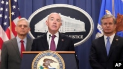 Secretary of Homeland Security Alejandro Mayorkas speaks with reporters during a news conference at the Department of Justice, in Washington, Dec. 6, 2023.