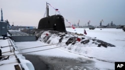 The newly built nuclear submarine The Krasnoyarsk is seen after a flag-raising ceremony on Monday for newly built nuclear submarines at the Sevmash shipyard in Severodvinsk in Russia's Archangelsk region, Dec. 11, 2023.