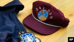 Portions of Air Force Capt. Jason Jenness' uniform are displayed on a table during an interview with the Associated Press in Missoula, Mont., on Aug., 26, 2023.