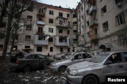 A view shows a residential building heavily damaged during a Russian missile attack, amid Russia's attack on Ukraine, in central Kharkiv, Ukraine, Jan. 2, 2024.