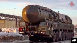 FILE - This photo made from video provided by the Russian Defense Ministry Press Service on March 29, 2023, shows a Yars missile launcher of the Russian armed forces being driven in an undisclosed location in Russia.