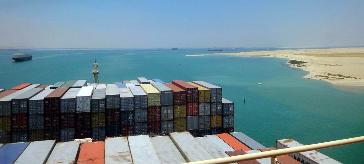 A container ship passes through the Suez Canal.