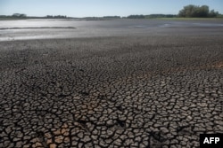 FILE - The Canelon Grande reservoir just north of Canelones, Uruguay, lies dry March 14, 2023, as the country goes through a severe drought.