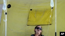 A dengue patient receives treatment at a provisional military field hospital, in the Ceilandia neighborhood of Brasilia, Brazil, Feb. 16, 2024.