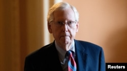 U.S. Senate Minority Leader Mitch McConnell, R-Ky., walks to the Senate floor before the vote to begin work on a bill that includes aid for Ukraine, Israel and Taiwan, at the U.S. Capitol in Washington, Feb. 9, 2024.