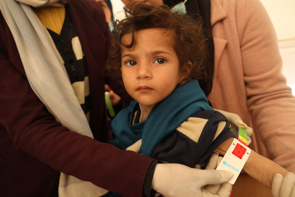 A two-year-old girl in Gaza is screened, indicating severe acute malnutrition and drastic weight loss and muscle atrophy.