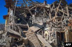 Rescuers work at the site of a missile attack in Mykolaivka, Donetsk region, amid the Russian invasion of Ukraine, March 28, 2024. (Ukrainian Emergency Service)