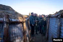 Ukrainian President Volodymyr Zelenskyy inspects new fortifications in the Chernihiv region on April 5, 2024. (Ukrainian Presidential Press Service via Reuters)