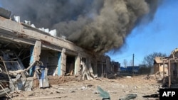 This handout photograph posted on the Telegram account of the head of Kharkiv Regional State Administration Oleh Synehubov on April 10, 2024, shows smoke rising over the building following a missile attack.