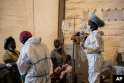 FILE - Health workers treat cholera patients at the Bwaila Hospital in Lilongwe, Malawi, Jan. 11, 2023.