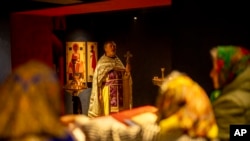 Christian Orthodox priest Hennadii Kharkivskyi leads a service at the chapel basement of the Church of the Intercession of the Blessed Virgin Mary in Lypivka near Lviv, Ukraine, April 28, 2024.