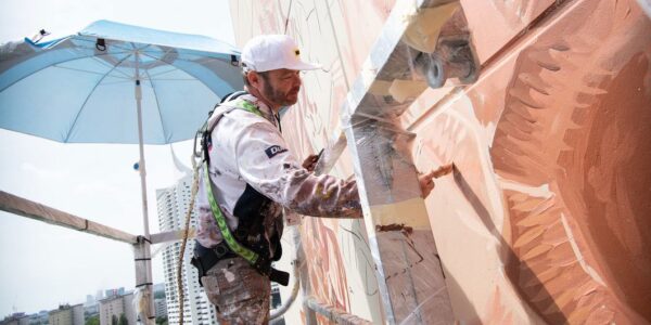 ‘Fragility of peace’ depicted in giant new mural on UN tower in Vienna