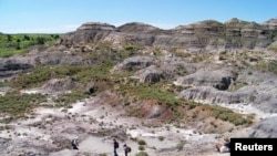 The Hell Creek badlands of southwestern North Dakota, U.S., where a fossil of a juvenile Tyrannosaurus rex was discovered, is seen in this July 2016 handout photo. (Erik Freeman/Handout via Reuters)