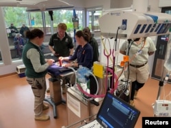 Taronga Western Plains Zoo team looks at a platypus being checked inside Taronga Wildlife Hospital at Taronga Western Plains Zoo, in this screen grab taken from a video, in Dubbo, Australia, July 8, 2024.