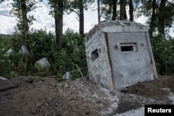 Antitank fortifications lie in ruins at a destroyed crossing point at the border with Russia, in the Sumy region, Ukraine, on Aug. 13, 2024.