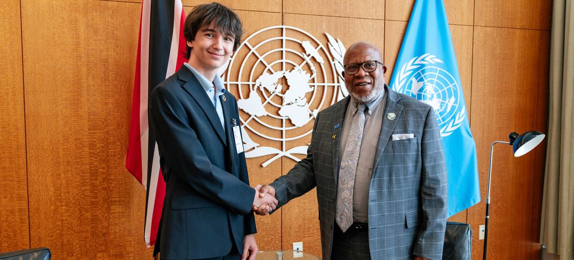 General Assembly President Dennis Francis (right) and New York City school student  Erik Ponomarev.