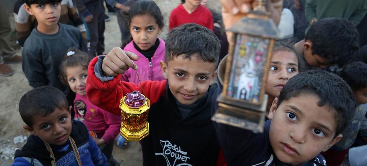 Children in Gaza hold lanterns to celebrate the advent of Ramadan in March. (file)