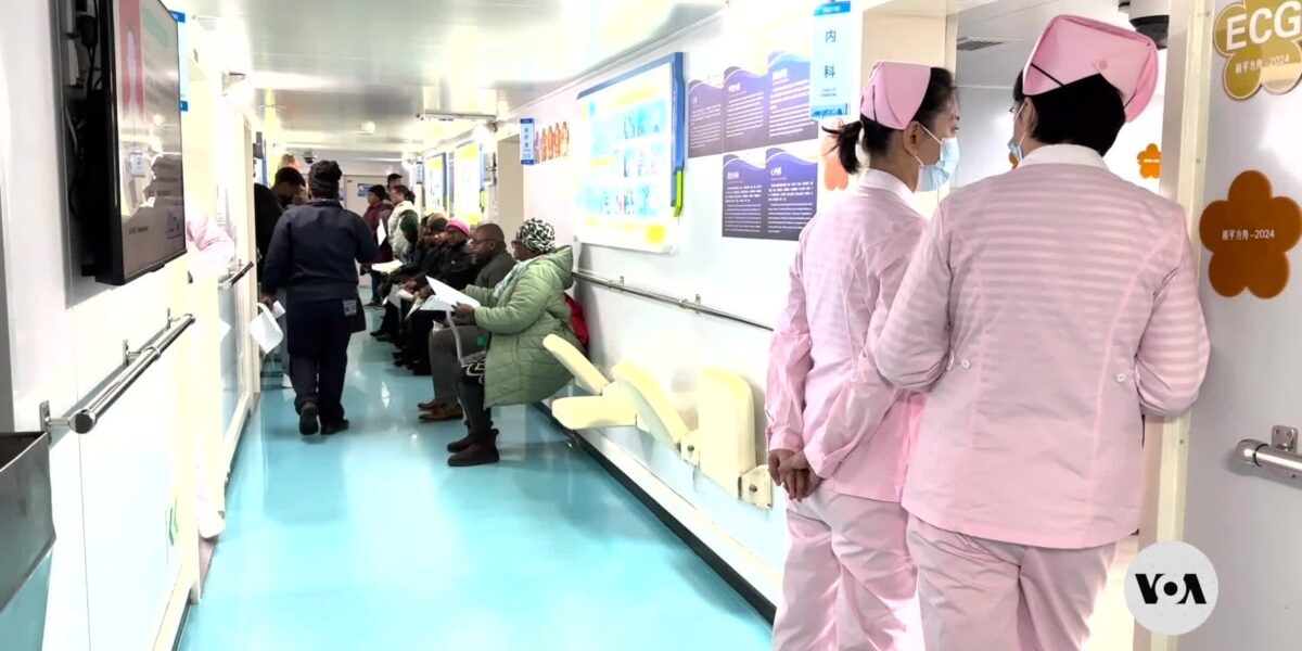 South Africans line up for medical care during Chinese hospital ship stop