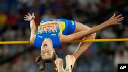 Ukraine in her heart, world-record high jumper goes for Paris gold