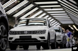 FILE - In this March 8, 2018 photo Volkswagen cars are pictured during a final quality control at the Volkswagen plant in Wolfsburg, Germany.