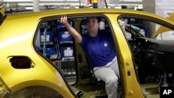 FILE - In this March 8, 2018 photo Volkswagen cars are pictured during the production at the Volkswagen plant in Wolfsburg, Germany.