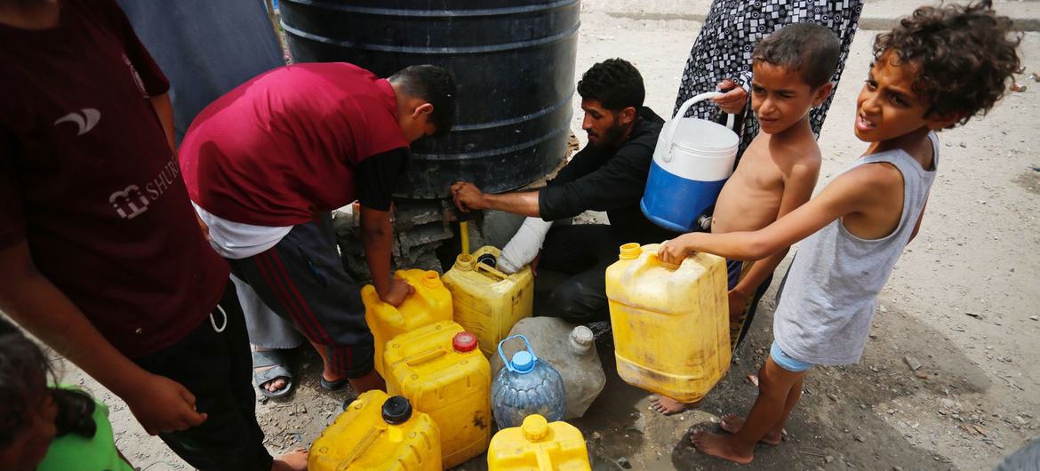 Children collect water in the Gaza Strip.