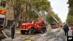 In this photo provided by the State Emergency Service of Ukraine on Sept. 4, 2024, Rescue workers work at a site of military university hit by a Russian strike in Poltava, Ukraine. (State Emergency Service of Ukraine via AP)