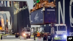 Dockworkers join other unions in trying to fend off automation, or minimize impact