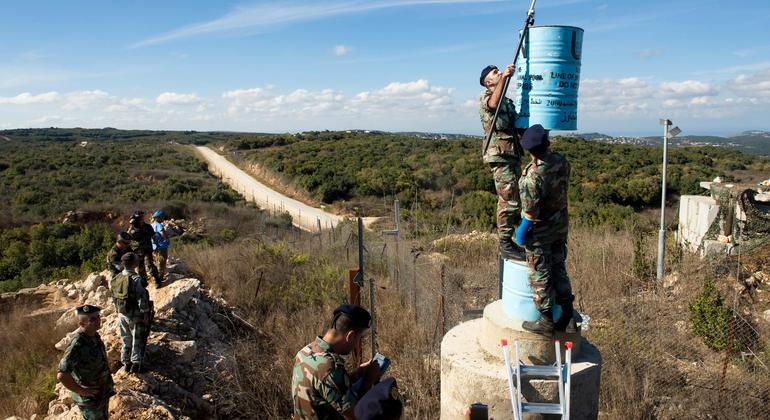 UNIFIL and Lebanese officers service one of the blue barrels, which determine the Blue Line, in southern Lebanon. (file)