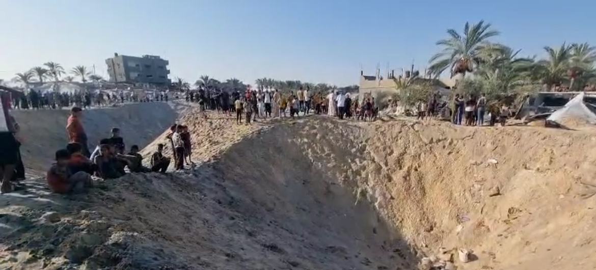 A large crater caused by an Israeli airstrike hit a makeshift camp for displaced people in Al-Mawasi, west of Khan Younis in Gaza.