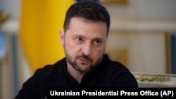 FILE - Ukrainian President Volodymyr Zelenskyy talks with Ukrainian journalists in Kyiv, Ukraine, Oct. 21, 2024.