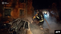 This handout photograph taken and released by the Ukrainian Emergency Service on Nov. 22, 2024, shows Ukrainian firefighters working on a spot following an air attack, in Sumy.