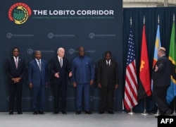 Biden caps Angola visit with stop at train terminal at western port