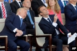 Macron welcomes Trump to Paris with presidential pomp, joined by Zelenskyy