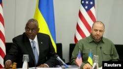 FILE - United States Secretary of Defense Lloyd Austin and Ukraine's Defense Minister Rustem Umerov attends the NATO defense ministers' meeting at the Alliance's headquarters in Brussels, June 13, 2024.